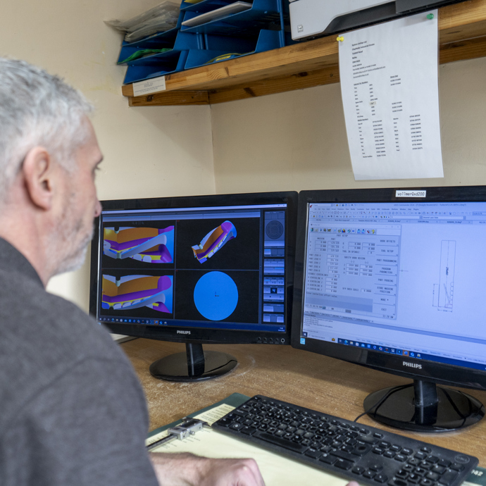 man designing a tool on a computer