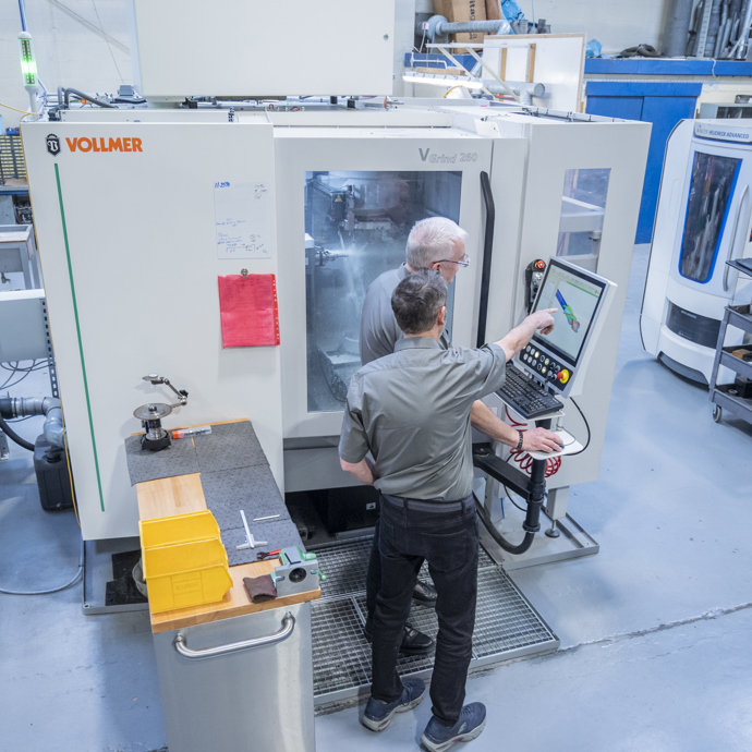 two men discussing a diamond cutting tool